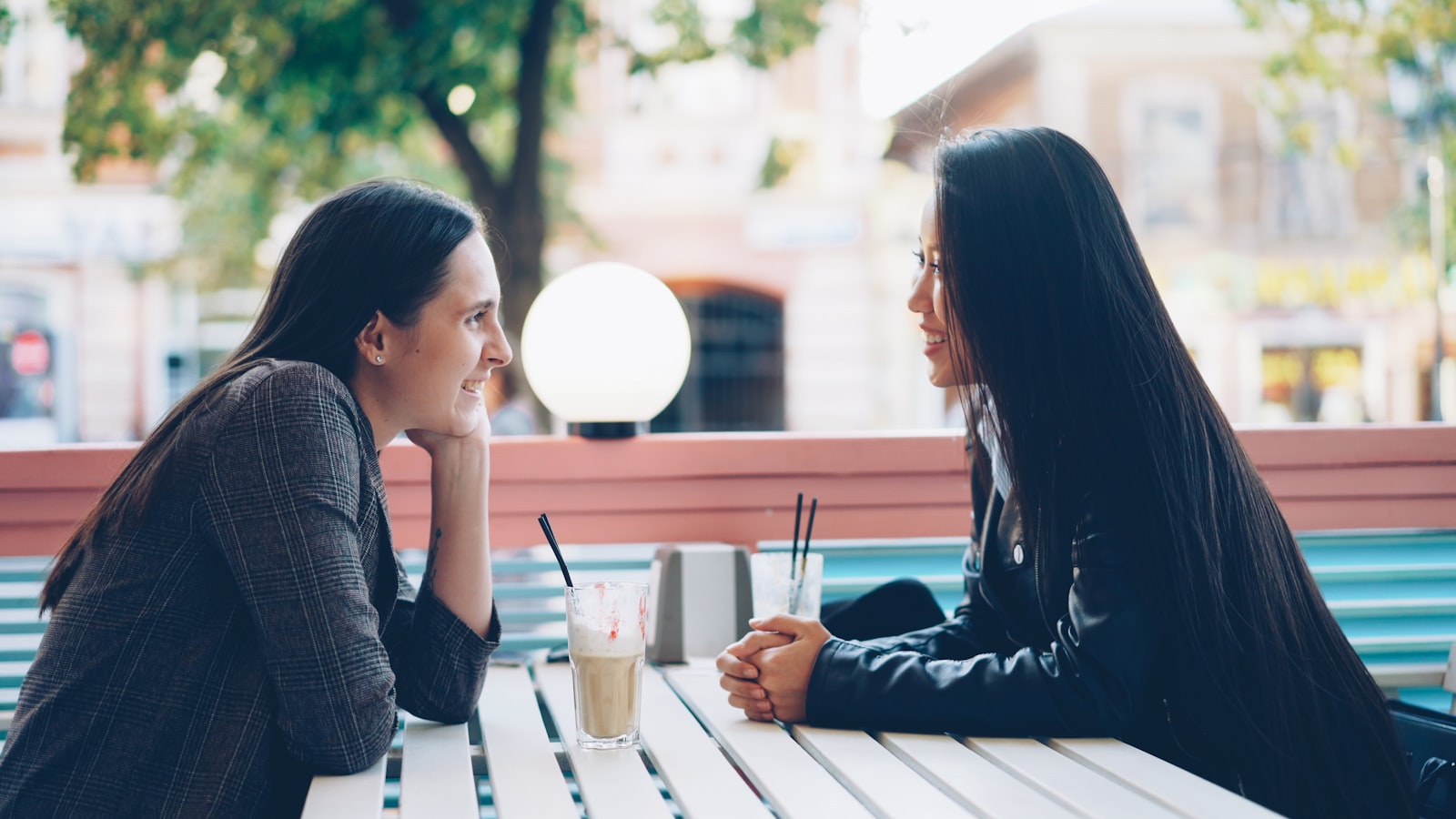 Two people having an unhurried chat on a terrace